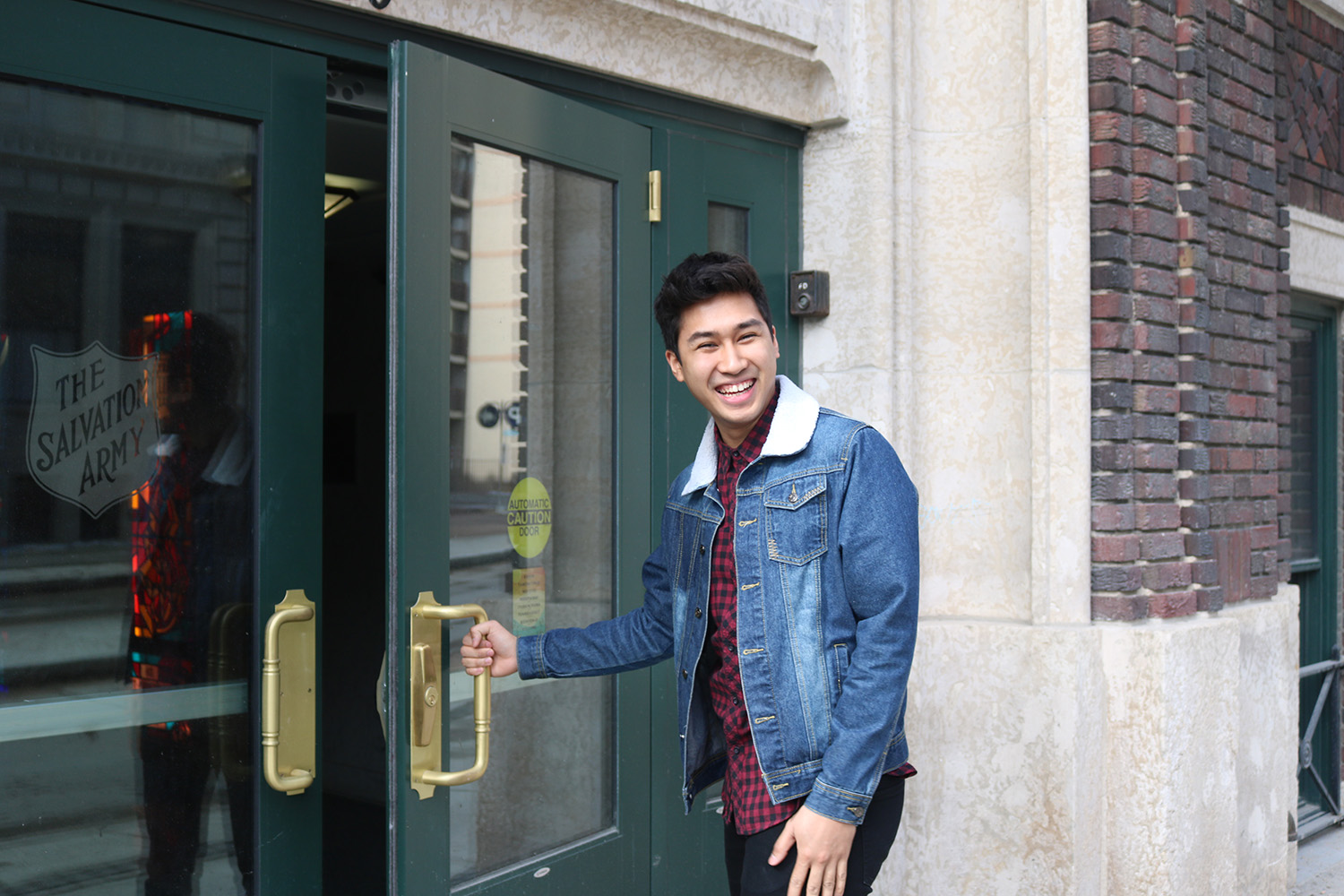 Josh at the front entrance of campus.